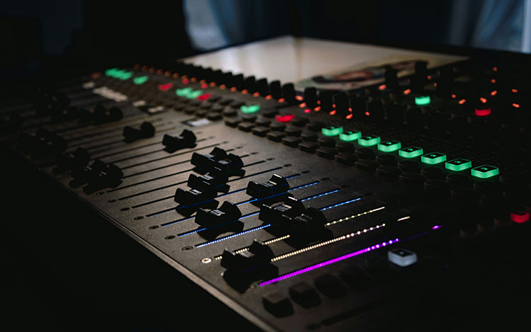 A mixing board. We offer Post Production Services in Toronto, Ontario